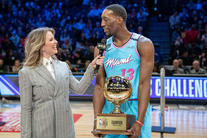 TNT sideline reporter Kristen Ledlow holds a microphone up to Miami Heat center Bam Adebayo